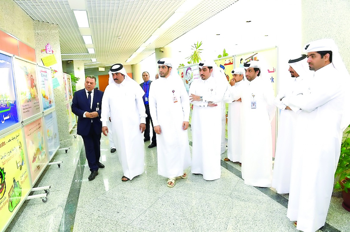 Officials at the educational exhibition for primary school students on food safety and nutrition.
