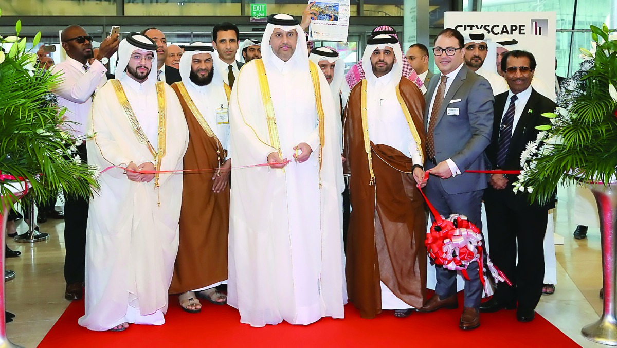 Minister of Economy and Commerce H E Sheikh Ahmed bin Jassim Al Thani along with other officials opening the sixth edition of Cityscape Qatar 2017 at the DECC, yesterday.