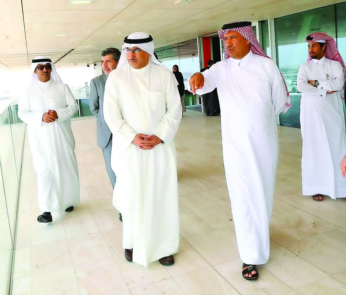 Dr Mohammed Abdulatif Al Fares, the Minister of Education and Higher Education of Kuwait, with Eng. Saad Ebrahim Al Muhannadi, lifetime member of the Board of Directors, QF, viewing the education and research buildings of Education City from the open-air 