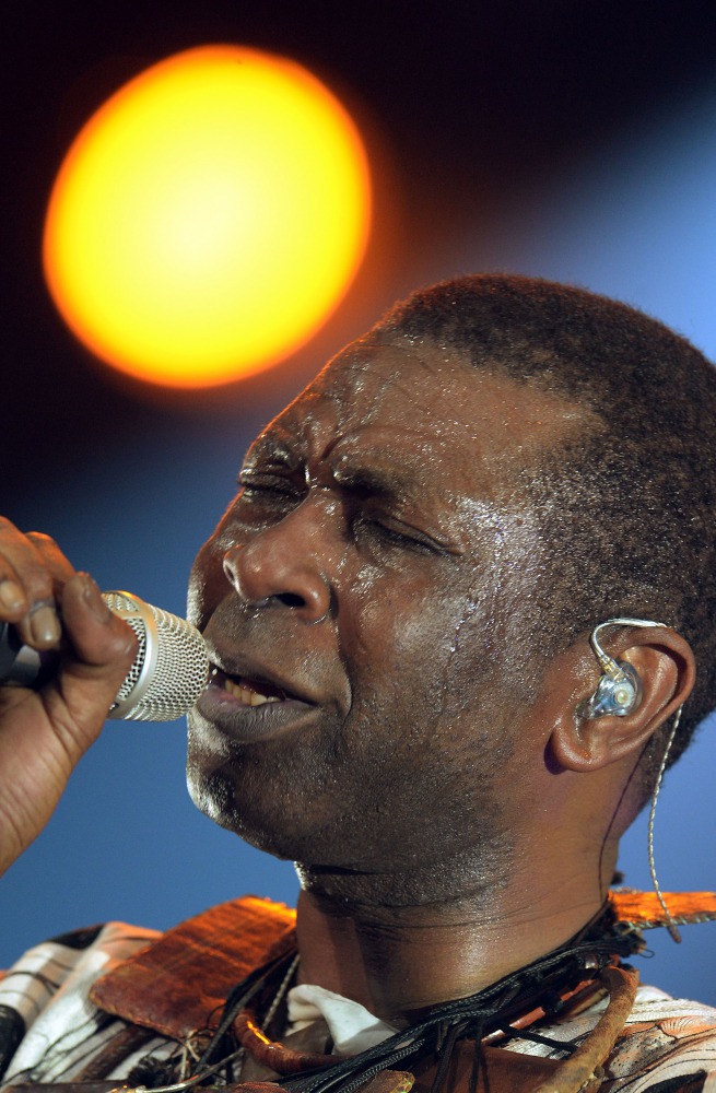 This file photo taken on October 12, 2013 shows Senegalese singer Youssou N'Dour performing during his concert at the Bercy concert hall, in Paris. Senegalese singer Youssou Ndour, advocate for the fight against malaria, hopes to see this scourge eradicat