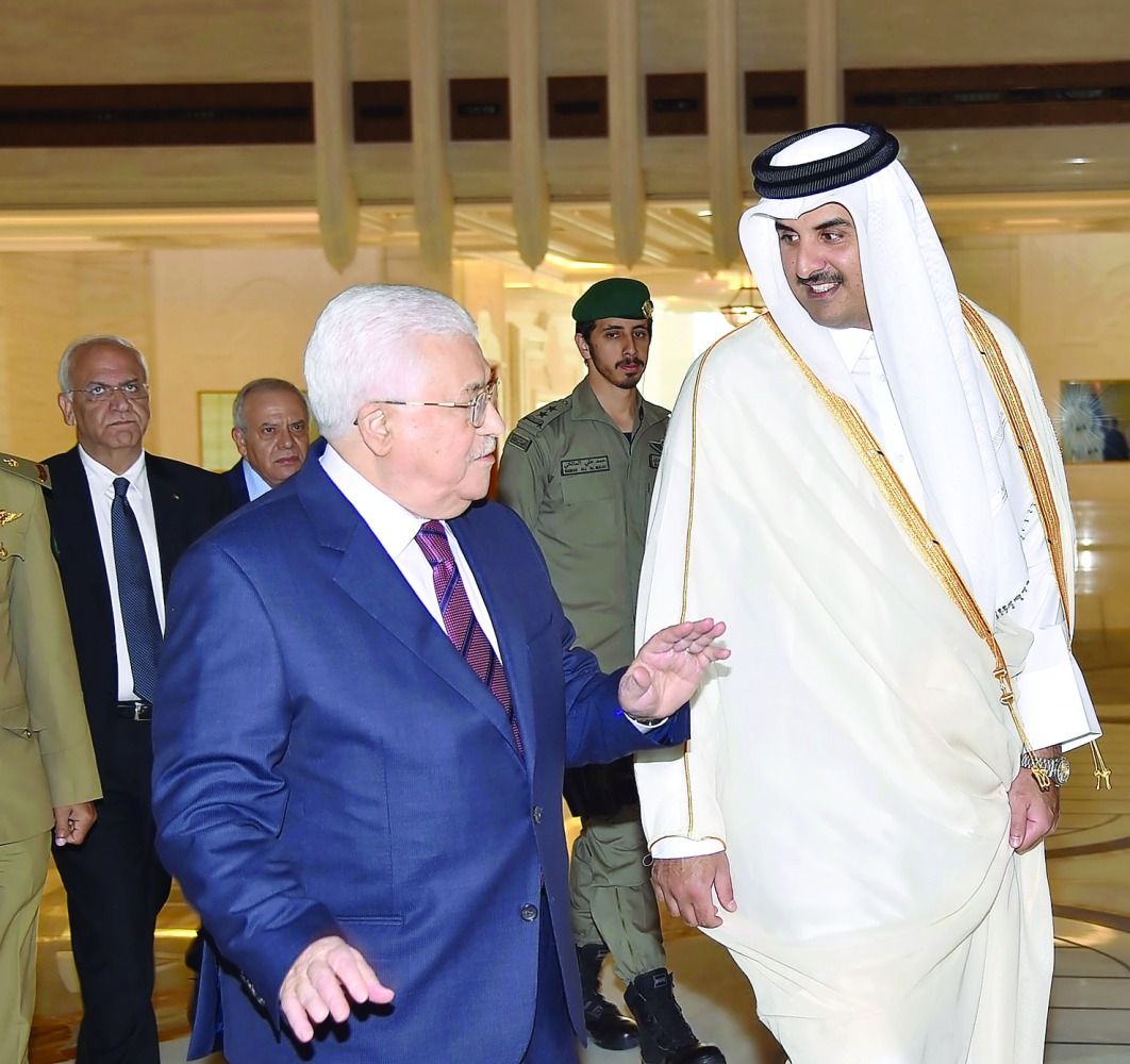 Emir H H Sheikh Tamim bin Hamad Al Thani with President of the State of Palestine, Mahmoud Abbas, at the Emiri Diwan, yesterday.
