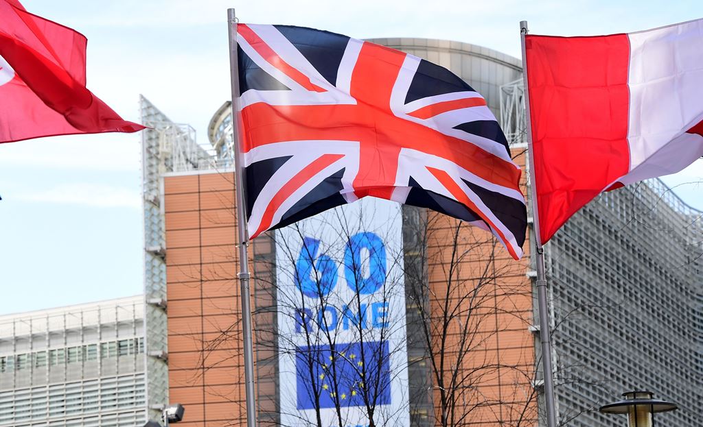 A Union Jack flag flies over a banner celebrating the 60th anniversary of 