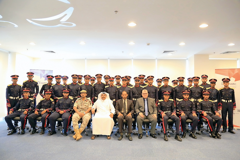 Students of Ahmed bin Mohammed Military College after attending lecture on human rights with Jaber Huwail, Ali Muharram and First Lieutenant Saleh Jar Allah Al Nabiet.
