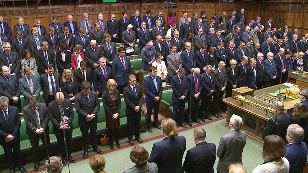 Members of Parliament stand for a minute's silence yesterday to pay tributes to those killed in an attack at Westminster, in London. 