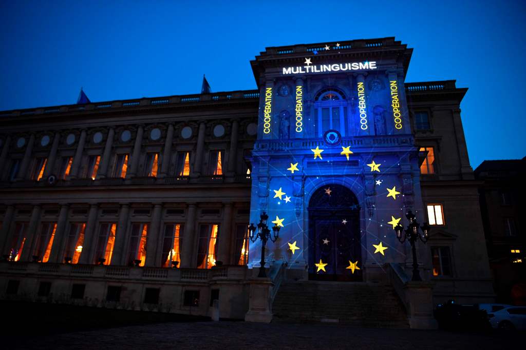 The word Multilingualism (in French) is displayed during a light show projected onto the French Foreign Ministry building to celebrate the 60th anniversary of the Treaty of Rome international agreement that established the creation of the European Economi