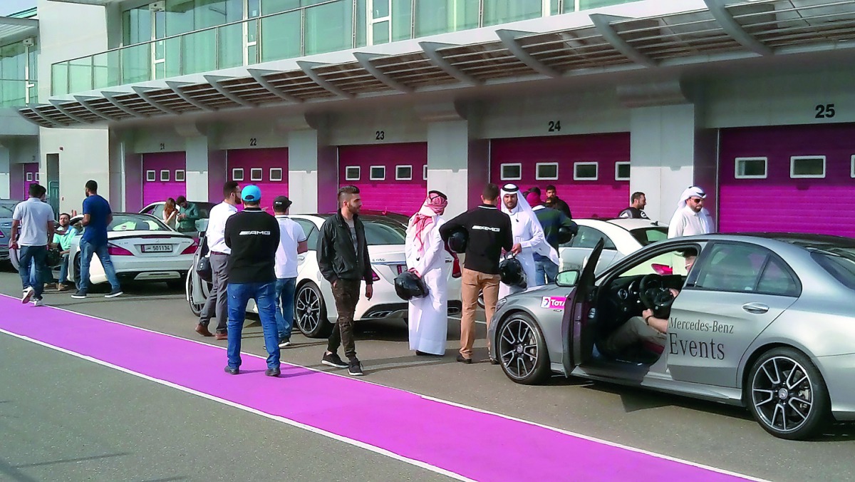 Mercedes-Benz customers and experts prepare to test drive the latest models of cars at Lusail Circuit.