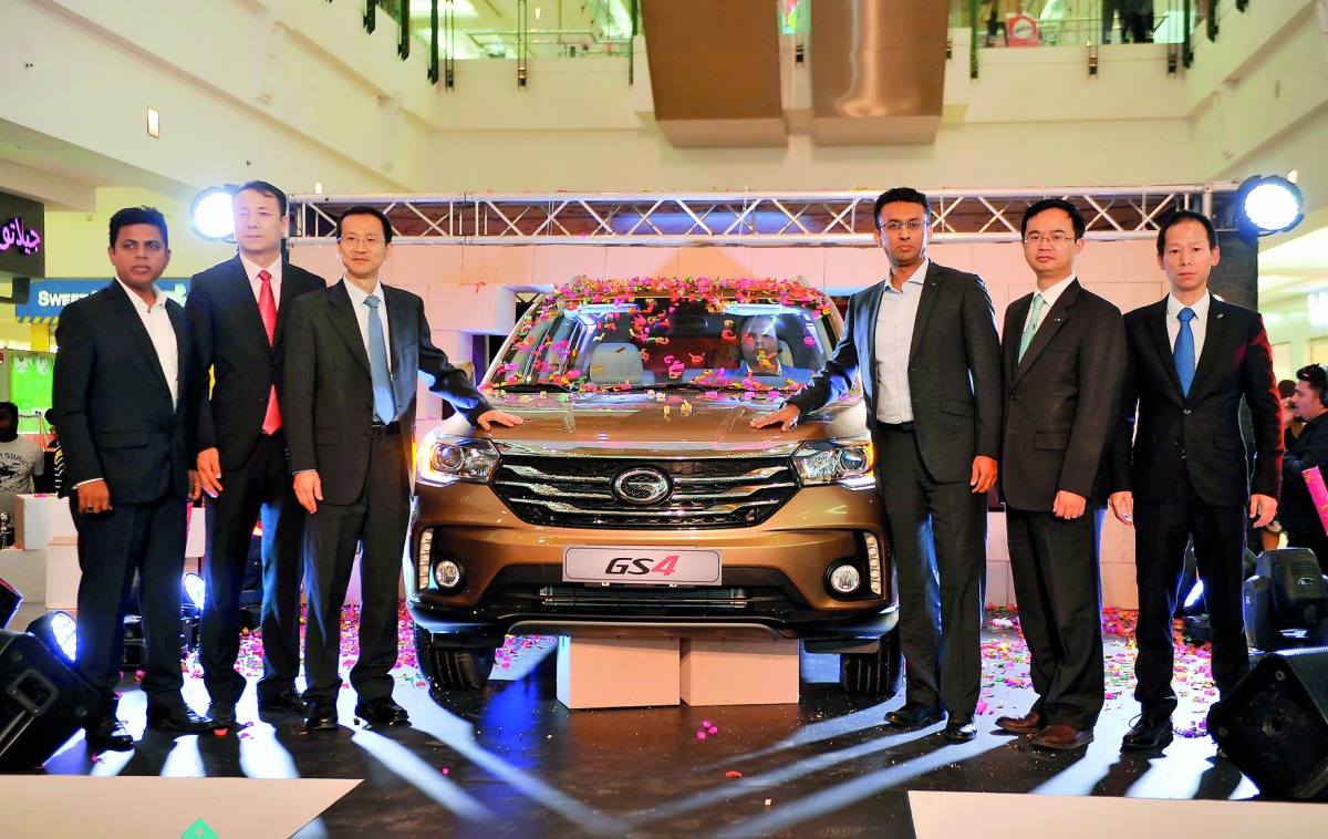 Yang Song (third left), Economic and Commercial Counsellor, Embassy of China; Guanfeng Hu (second right), Vice Director of International business division - GAC Motor; and Faisal Sharif (third right), Mananging Director, Domasco, with other officials and 
