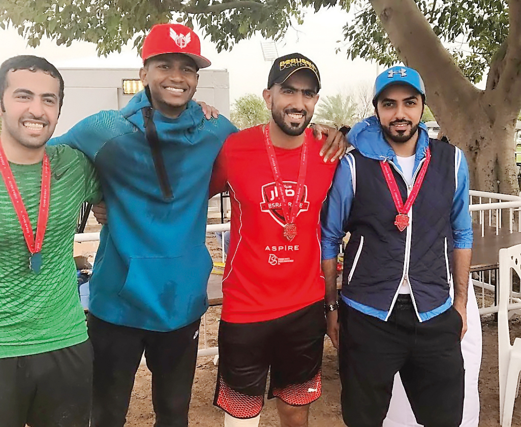 Olympic medallist, Mutaz Barshim of Qatar poses for a picture with the podium winners at the Qatar’s first ever obstacle course race – ‘Esrar’ held yesterday at Aspire Zone.