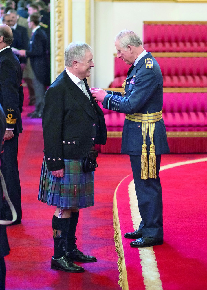 Ian Gray, CEO of Vodafone Qatar, being granted an Officer of the Most Excellent Order of the British Empire (OBE) by HRH Prince Charles at Buckingham Palace.
