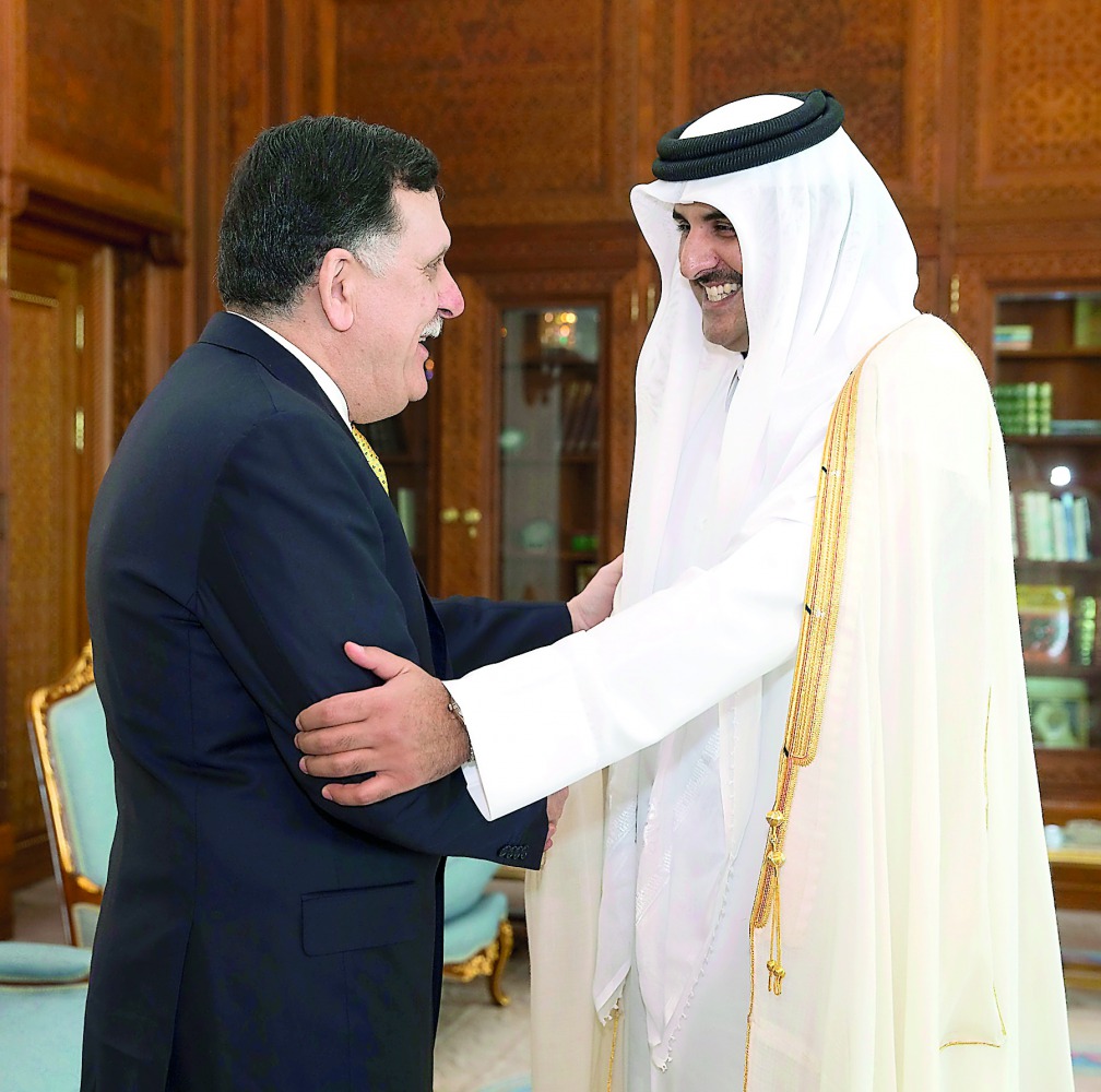 Emir H H Sheikh Tamim bin Hamad Al Thani with Chairman of the Presidential Council of Libya and Prime Minister of the Government of National Accord, Fayez Al Sarraj, at Emiri Diwan yesterday. Al Sarraj briefed the Emir on the latest developments in Libya 