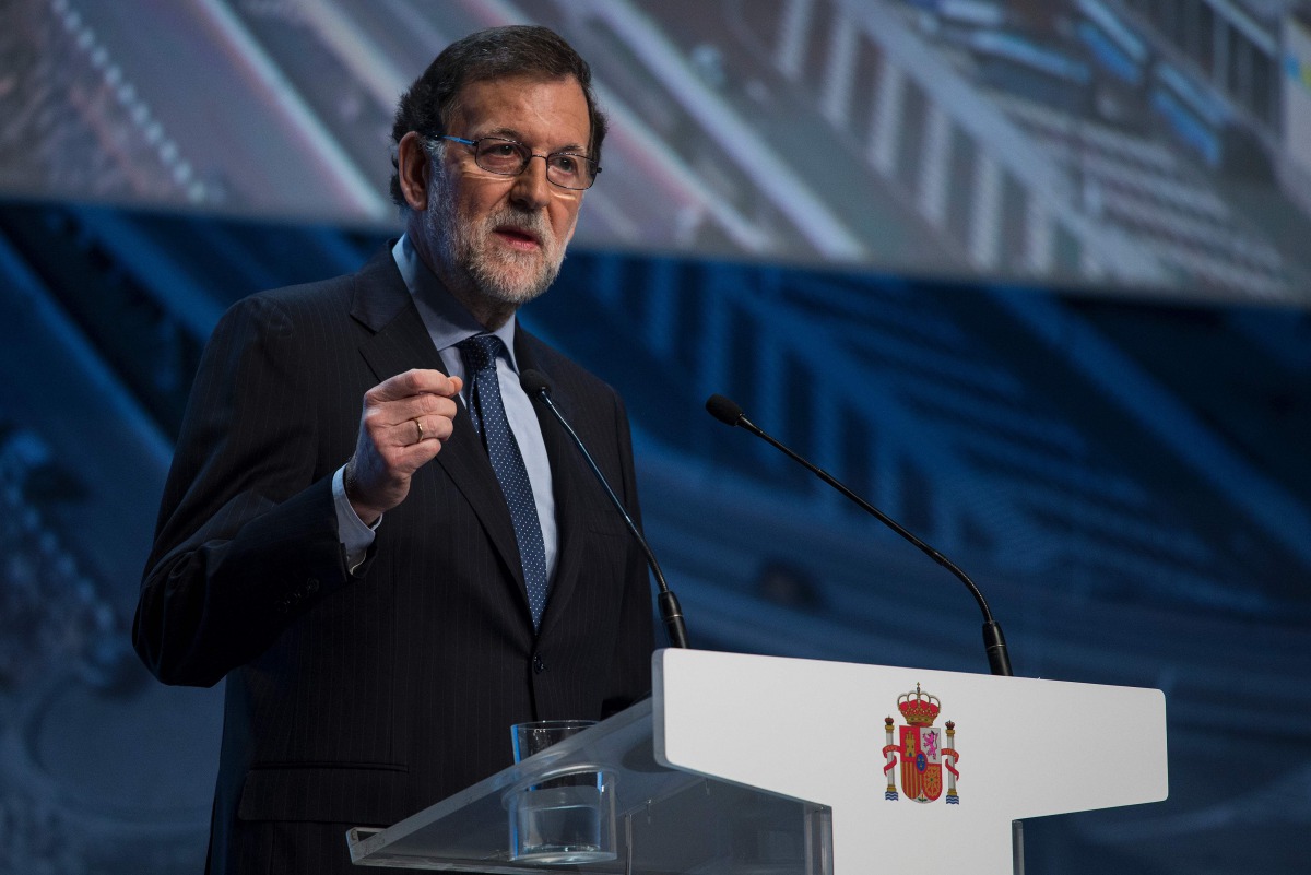 Spanish Prime Minister Mariano Rajoy makes the opening speech during a conference on infrastructure under the slogan 