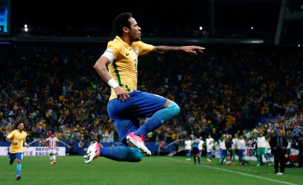 Brazil's forward Neymar celebrates after scoring against Paraguay during their 2018 FIFA World Cup qualifier football match in Sao Paulo, Brazil on March 28, 2017. / AFP / Miguel SCHINCARIOL
