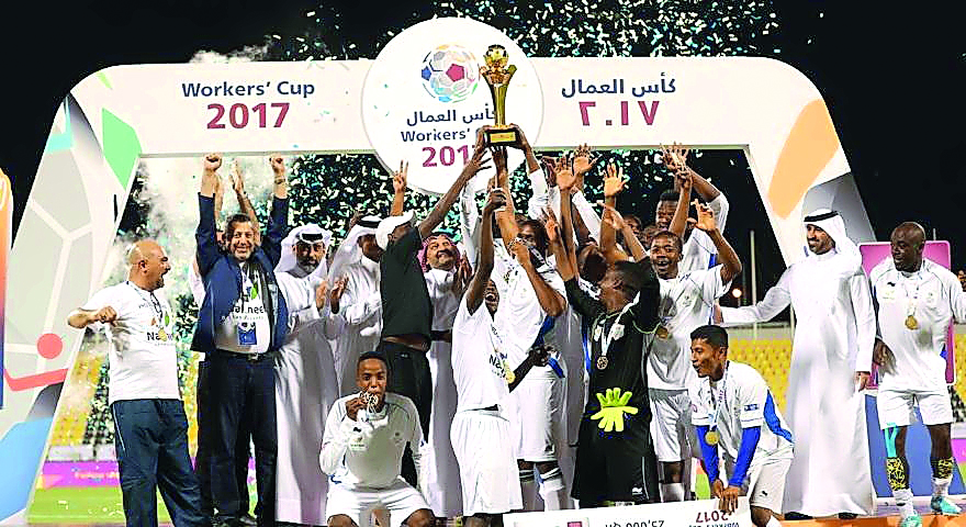 Nakheel Landscapes team players and officials celebrate with the Workers Cup 2017 trophy.