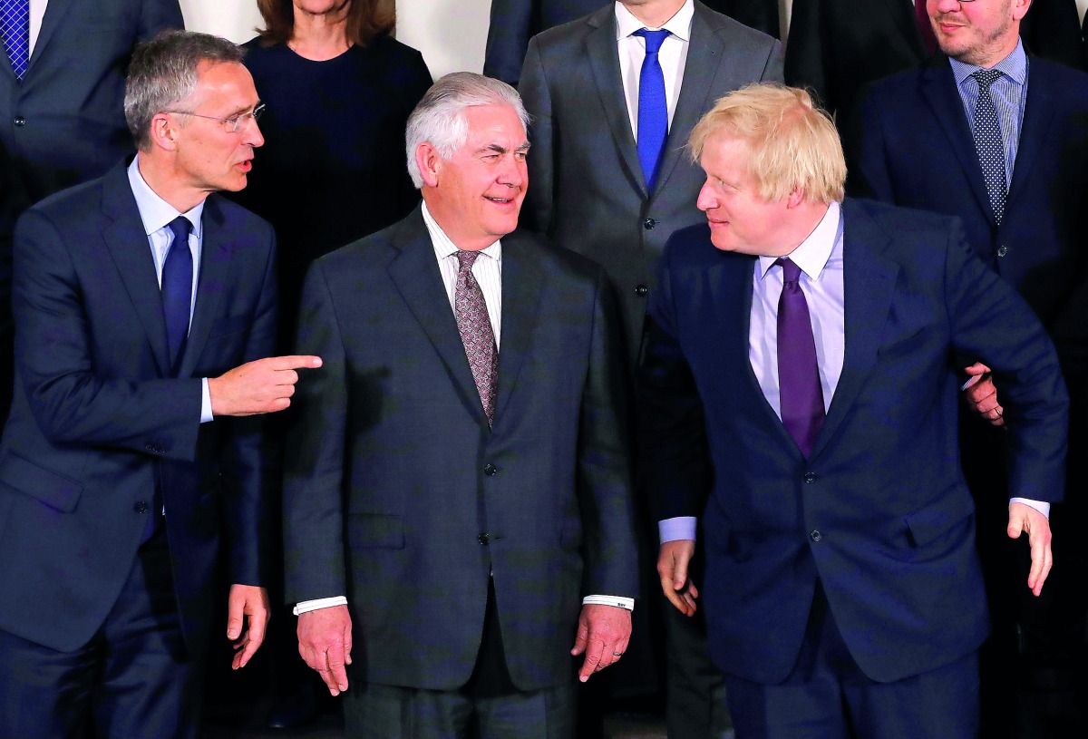 FROM LEFT: Nato Secretary-General Jens Stoltenberg, US Secretary of State Rex Tillerson and British Foreign Secretary Boris Johnson take part in a meeting of Nato foreign ministers at the Alliance's headquarters in Brussels, yesterday.