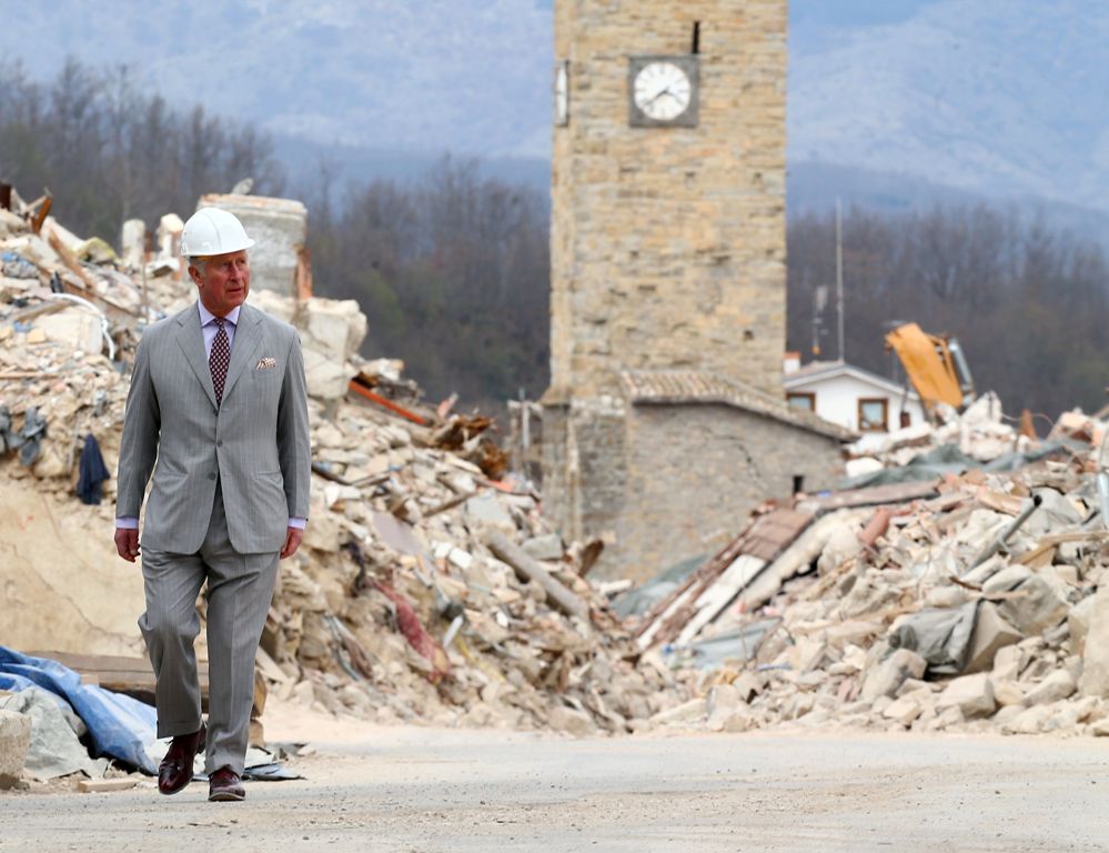 Britain's Prince Charles, Prince of Wales, visits the Italian quake-hit town of Amatrice on April 2, 2017 as part of his European tour aimed at strengthening relations with EU allies post Brexit. / AFP / POOL / ALESSANDRO BIANCHI
