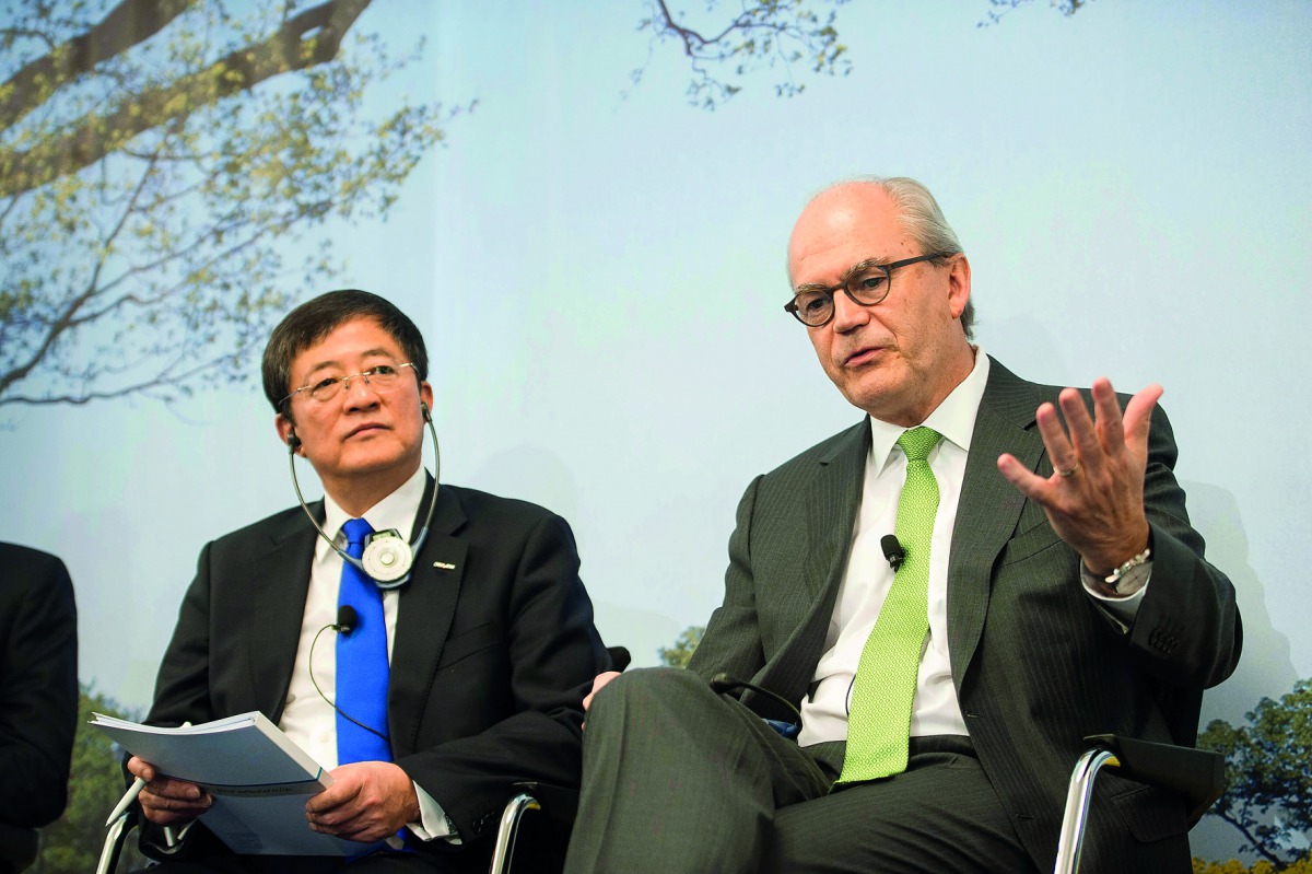 Michel Demaré, Chairman of Syngenta (right) and Ren Jianxin, Chairman of ChemChina at an event in Basel, Switzerland.