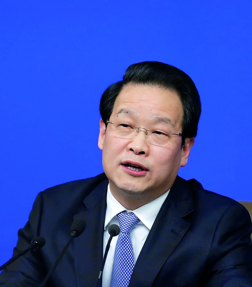 Xiang Junbo, chairman of China Insurance Regulatory Commission (CIRC), attends a news conference on the sidelines of the National People's Congress (NPC) in China's parliament, in Beijing, China March 12, 2016. Picture taken March 12, 2016. REUTERS/Jason 