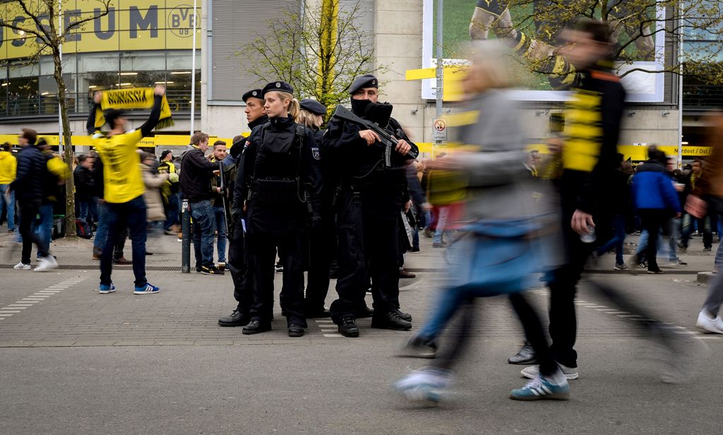 Police patrol outside the stadium prior to the UEFA Champions League 1st leg quarter-final football match BVB Borussia Dortmund v Monaco in Dortmund, western Germany on April 12, 2017. / AFP / SASCHA SCHUERMANN
