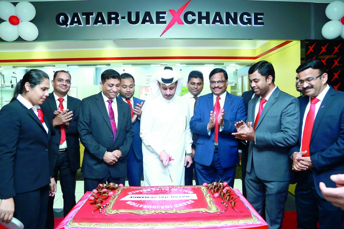 Hamad Ghanim Al Hudaifi Al Khuwari inaugurating Qatar-UAE Exchange along with Qatar-UAE Exchange Regional Head Varghese Mathew and Country Head Mathai Vaidian as well as other well-wishers at Mall of Qatar.