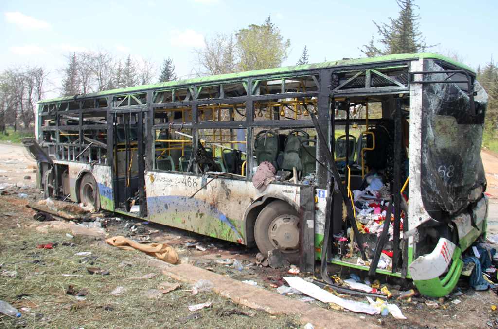 A picture taken on April 16, 2017, shows the damage a day after a suicide car bombing attack in Rashidin, west of Aleppo, targeted busses carrying Syrians evacuated from two besieged government-held towns of Fuaa and Kafraya.   AFP / Omar haj kadour
