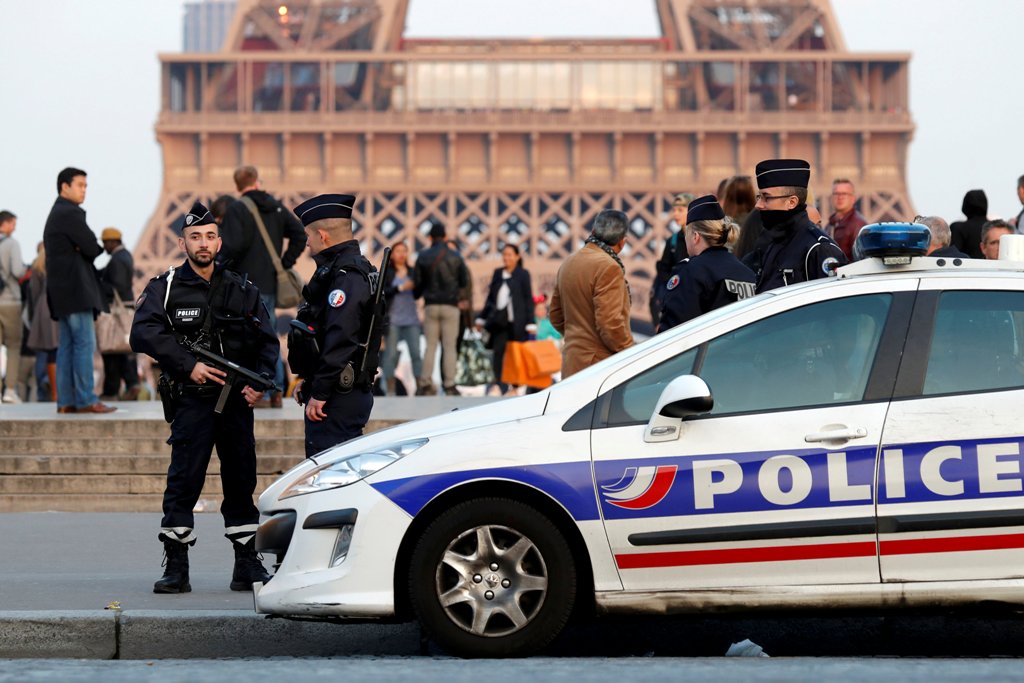 Police patrol at the Trocadero near the Eiffel Tower after a policeman was killed and two others were wounded in a shooting incident in Paris, France, April 21, 2017. REUTERS/Charles Platiau
