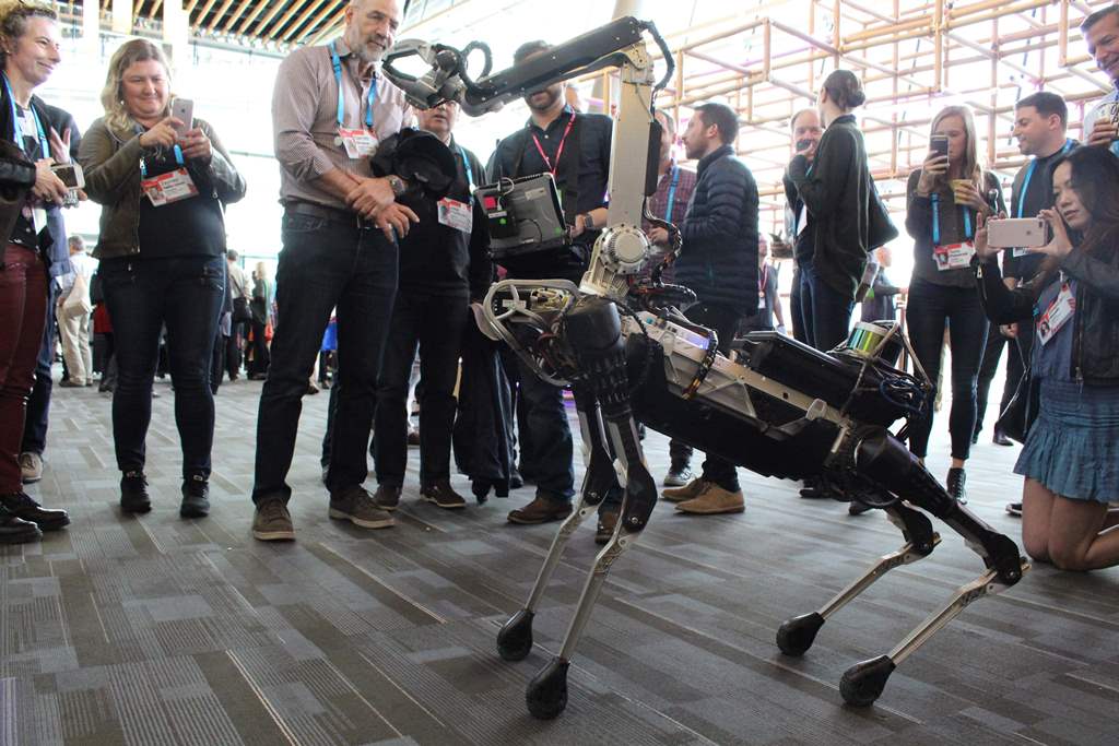 A Boston Dynamics Spot robot mingles with the crowd at the TED Conference in Vancouver, Canada, on April 25, 2017. AFP / Glenn CHAPMAN