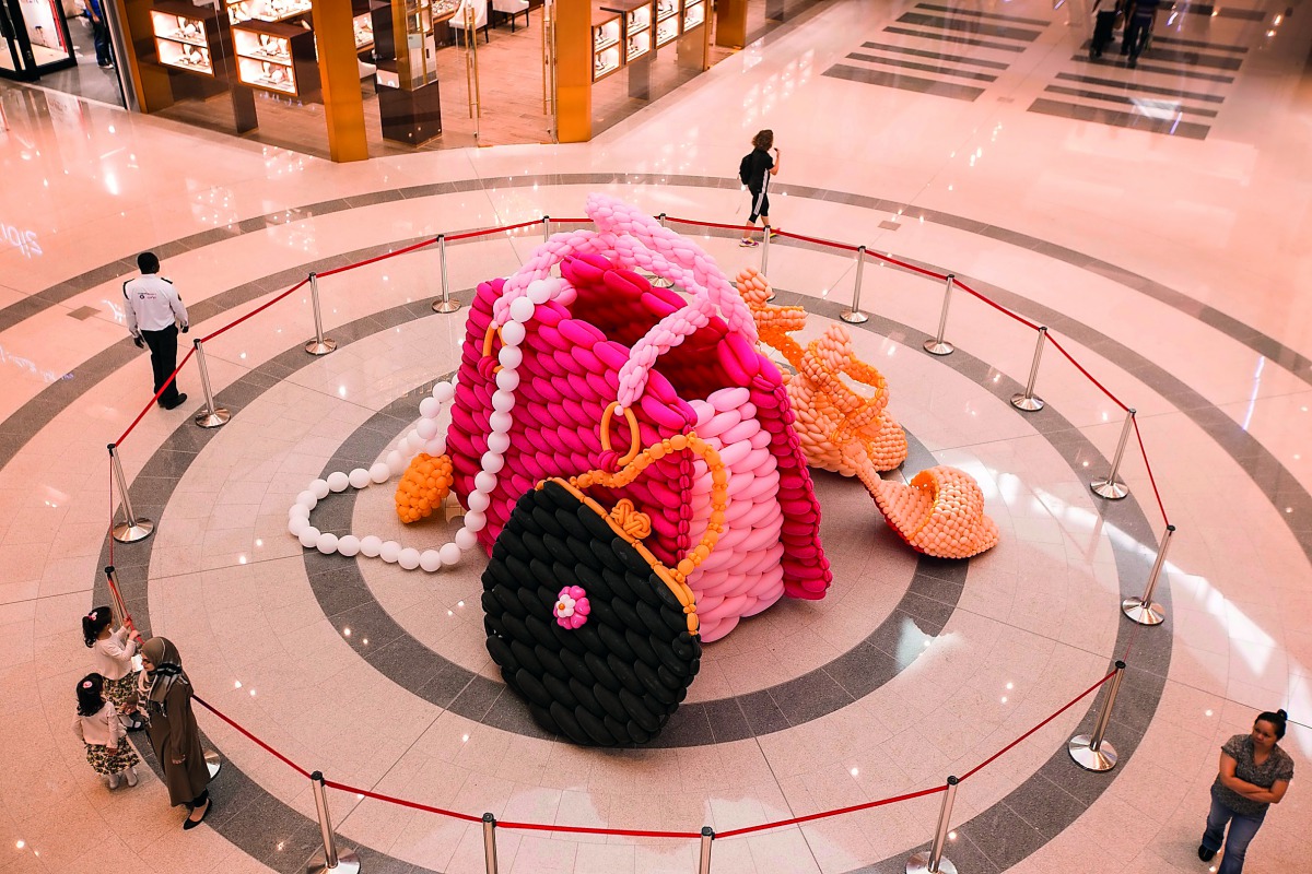 Bags and heels made of balloons by world-renowned artist Larry Moss and his team of 11 international artists, at the Doha Festival City.