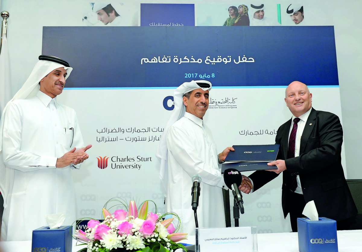 Chairman of General Authority of Customs, Ahmed bin Abdullah Al Jamal (left), Dr Ibrahim Saleh Al Naimi, President of Community College of Qatar (CCQ), and Prof David Widdowson, Head of Centre for Customs and Excise Studies at the Charles Sturt University