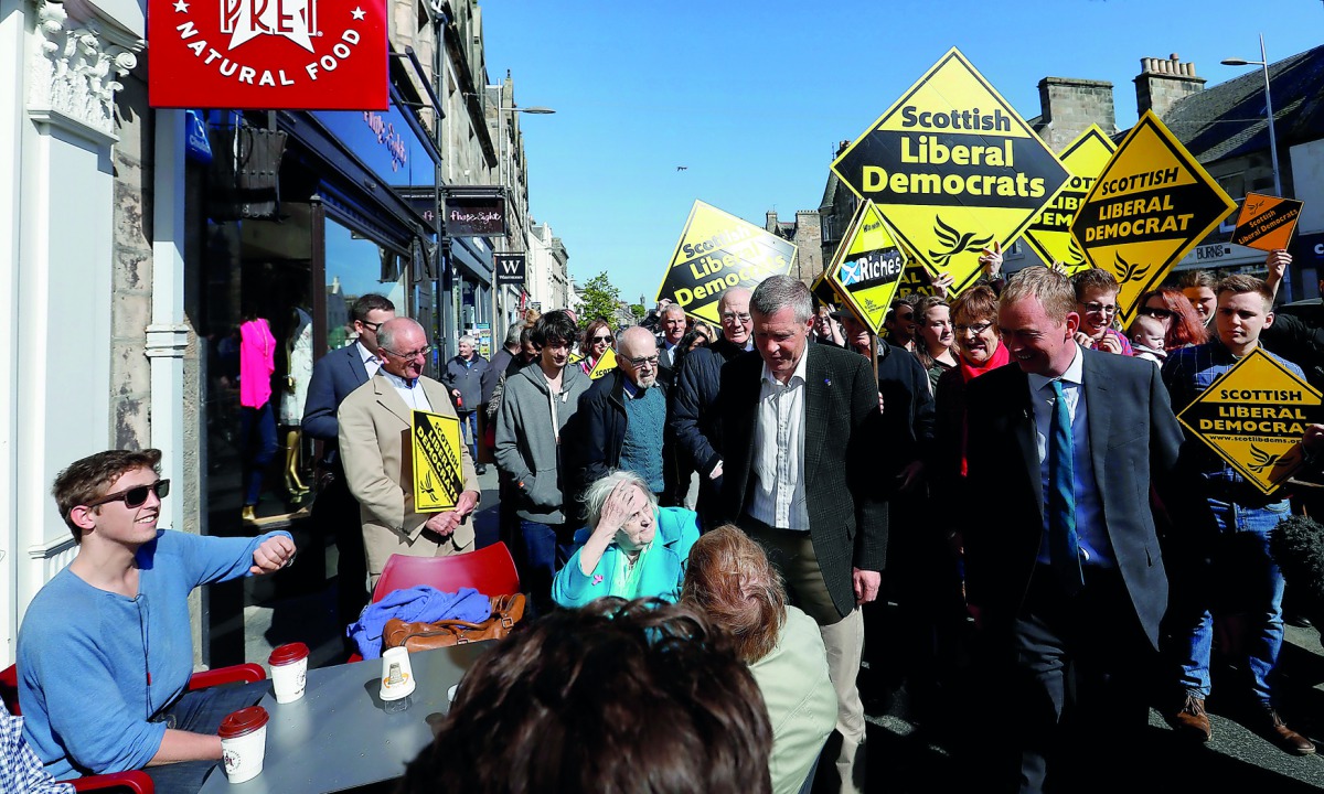 Tim Farron, leader of Britain's Liberal Democrat Party, campaigns in St Andrews, Scotland, yesterday.