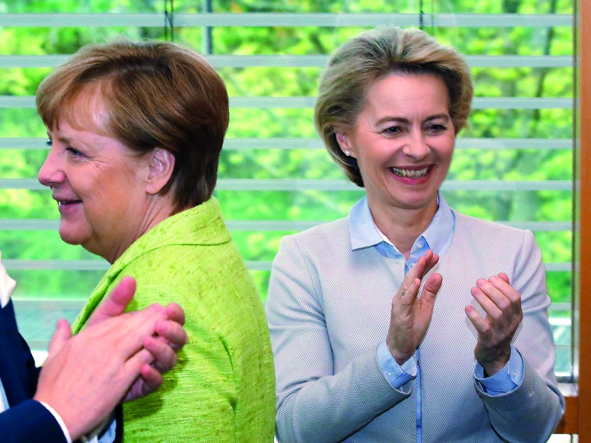 German Chancellor Angela Merkel (left) and Defence Minister Ursula von der Leyen at a CDU board meeting, in Berlin, yesterday.