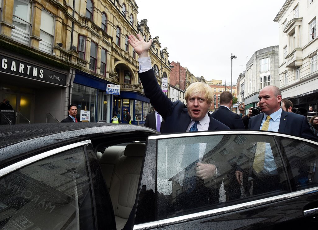 Britain's Foreign Secretary Boris Johnson waves as he leaves campaign event in Newport Market, Wales, May 12, 2017. Reuters/Rebecca Naden
