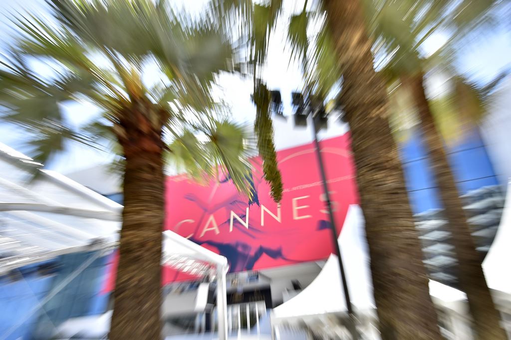 A picture taken on May 15, 2017 in Cannes, southeastern France, shows the affiche for the 70th Cannes Film Festival hanging from the facade of the Palais des Festivals along the top end of The Croisette. AFP / LOIC VENANCE