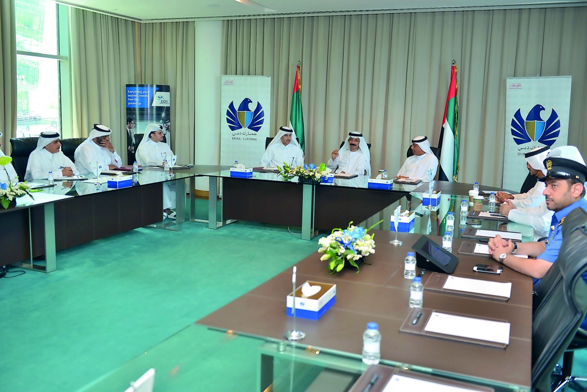Customs officials from Qatar interacting with Dubai Customs officials. 