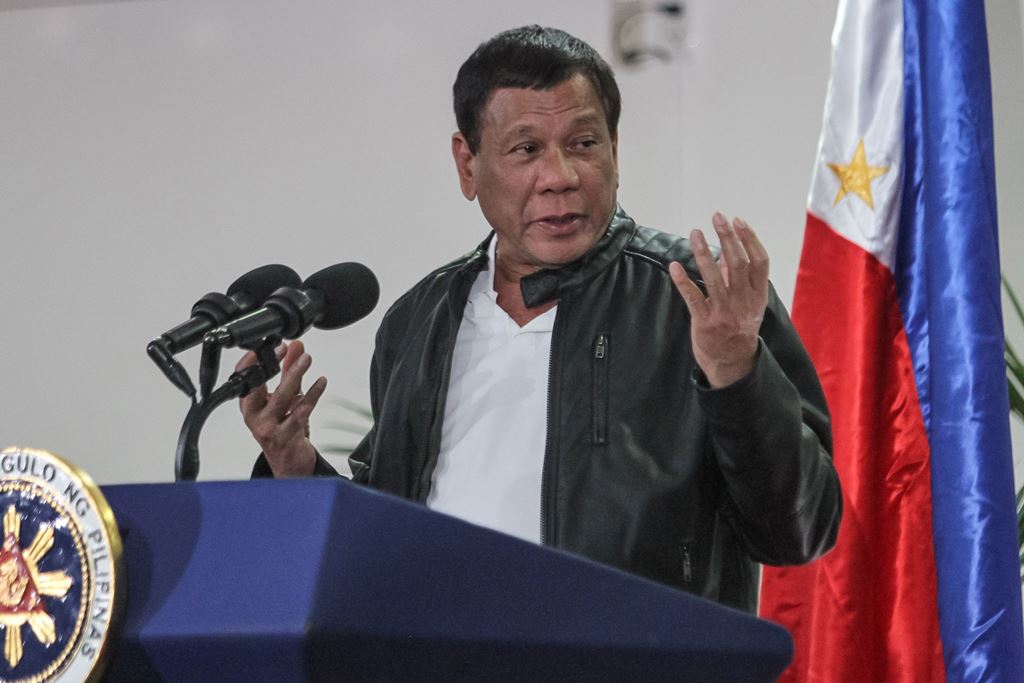 Philippine President Rodrigo Duterte gestures as he speaks shortly after arriving in Davao on May 16, 2017, from a working visit to China. AFP / MANMAN DEJETO
