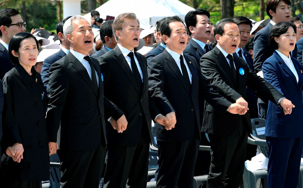 South Korean President Moon Jae-In (3L) attends the annual Democratic uprising memorial at the Gwangju National Cemetery, in the southwestern city of Gwangju on May 2017, as the government holds an annual ceremony to mark the 37th anniversary of a pro-dem