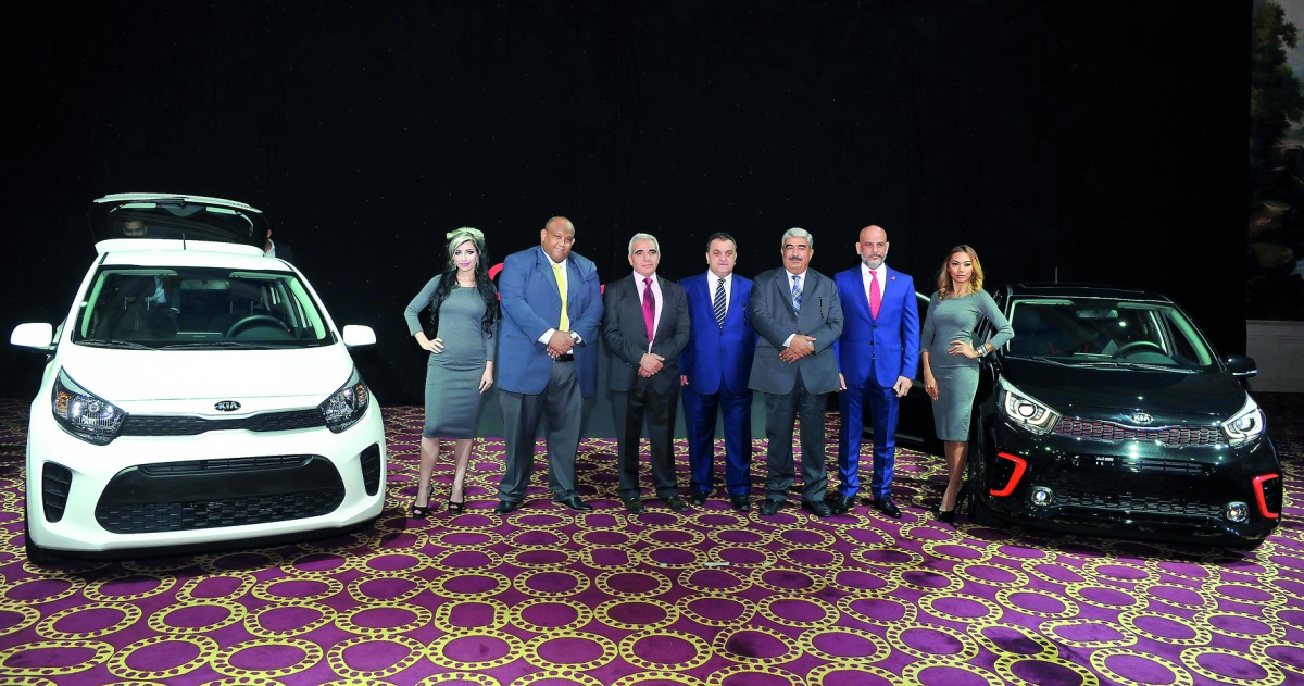 Mohamed Maali (third left), CEO of Al Attiya Motors and Trading Company (AMTC), and Isam El Bashier (second left), CRM Manager, along with other officials during the launch of the all-new Kia Picanto at La Cigale Hotel.  Pic: Kammutty VP/ The Peninsula