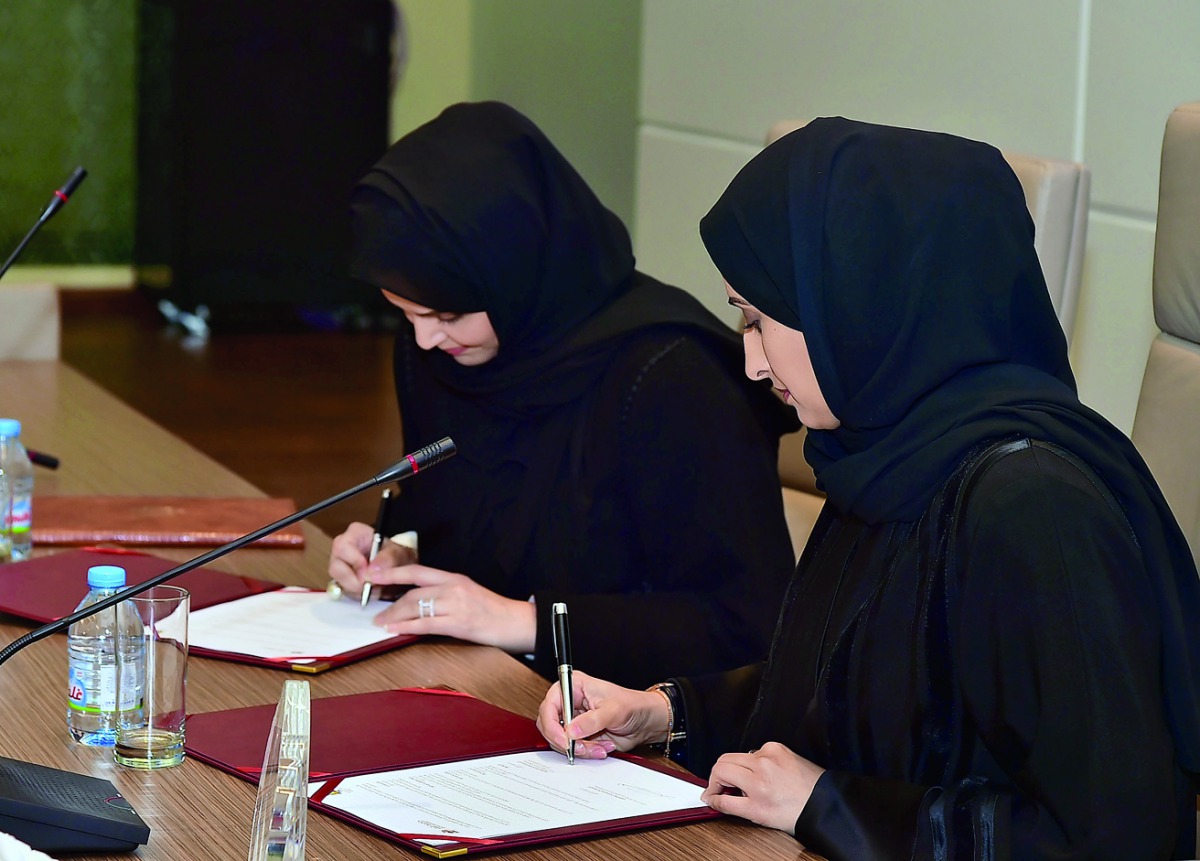 QU Director of Student Development Haya Al Attiya and Best Buddies Qatar Executive Director Laalei Abu Alfain signing the MoU.