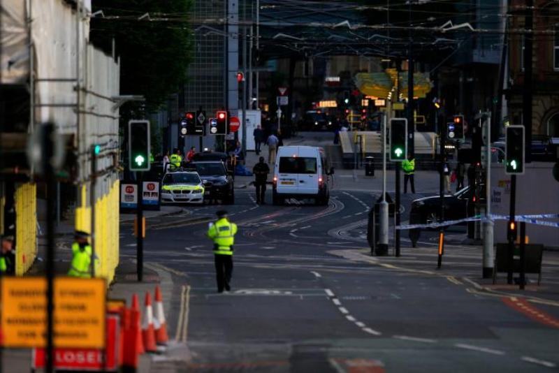 Police patrol the secure area outside the Manchester Arena in central Manchester, Britain
