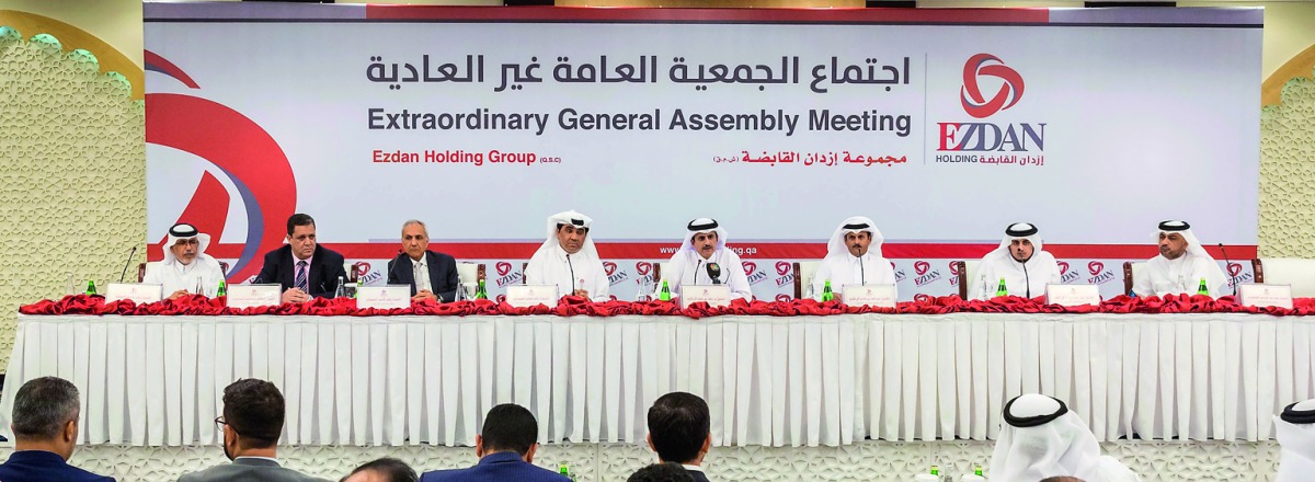 Sheikh Dr Khalid bin Thani Al Thani (second right), Chairman of the Board of Directors of Ezdan Holding Group, presiding over the Company’s Extraordinary General Assembly Meeting yesterday. 