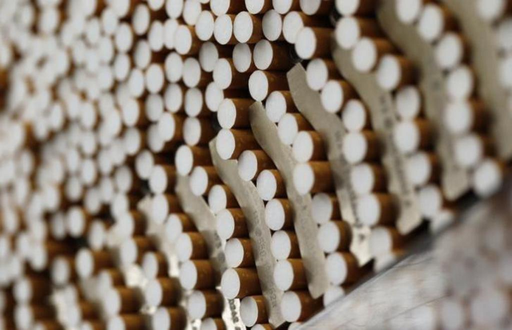 Cigarettes are seen during the manufacturing process in the British American Tobacco Cigarette Factory (BAT) in Bayreuth, southern Germany, April 30, 2014. British American Tobacco, the world's No. 2 cigarette maker, posted improved sales volume for the f