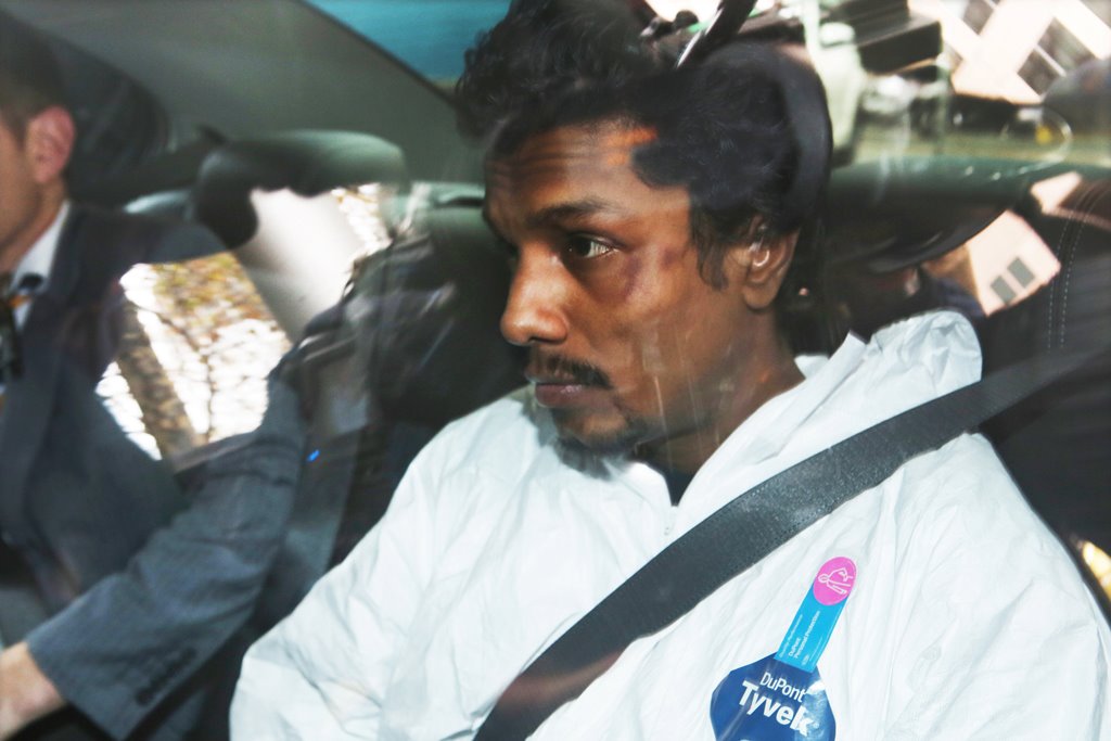 A man who was arrested for trying to enter the cockpit of Malaysia Airlines flight MH128 is driven into the Melbourne Magistrates Court in Melbourne, Australia, June 1, 2017. AAP/David Crosling/via REUTERS
