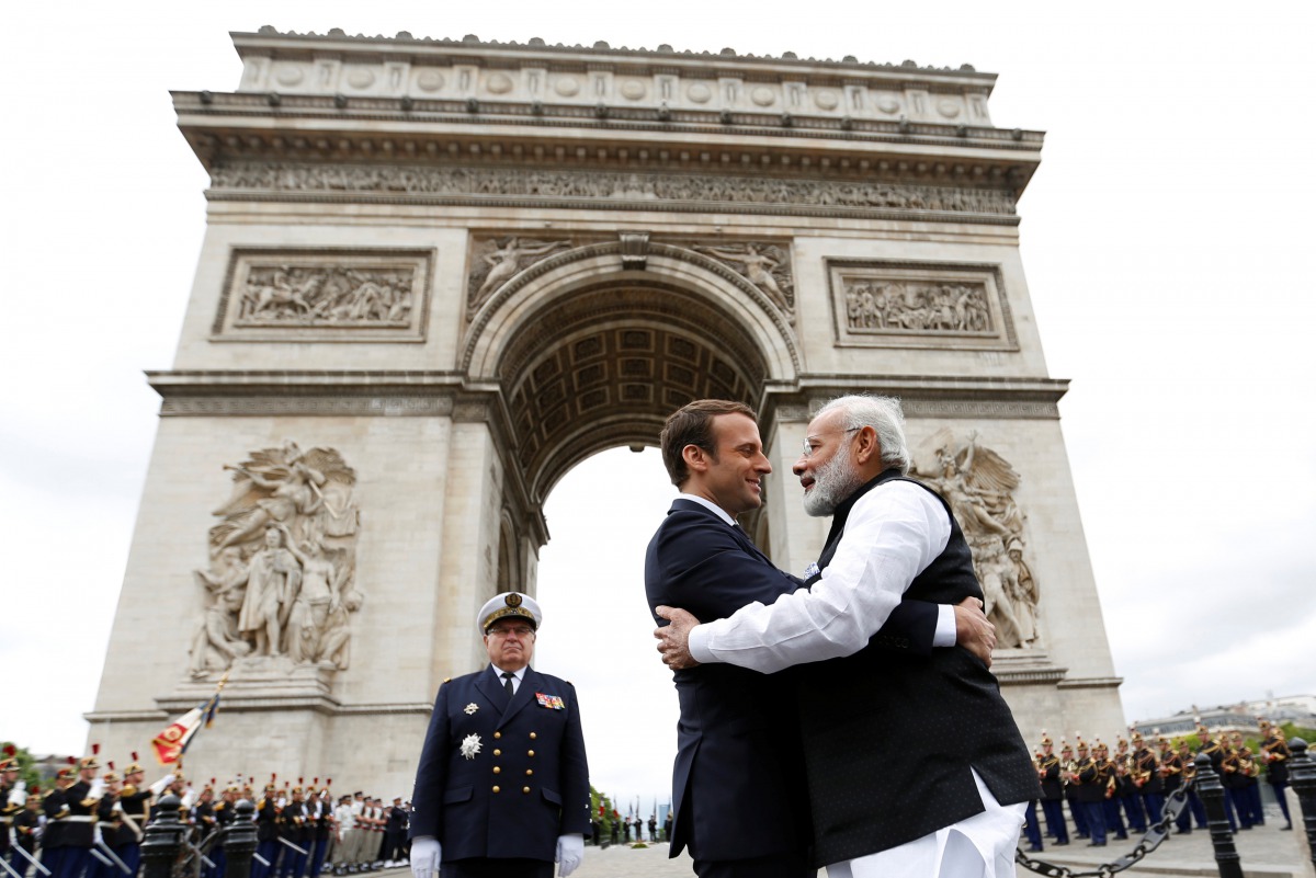 Prime Minister Narendra Modi (R) says goodbye to French President Emmanuel Macron after a ceremeny at the Arc de Triomphe on the last leg of his four-nation visit in Paris, France, June 3, 2017. (REUTERS/Charles Platiau)