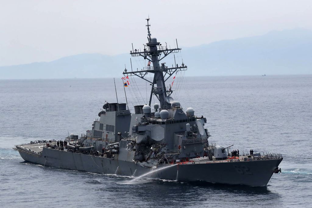 This picture shows the guided missile destroyer USS Fitzgerald off the Shimoda coast after it collided with a Philippine-flagged container ship on June 17, 2017. Japan OUT / AFP / JIJI PRESS / STR