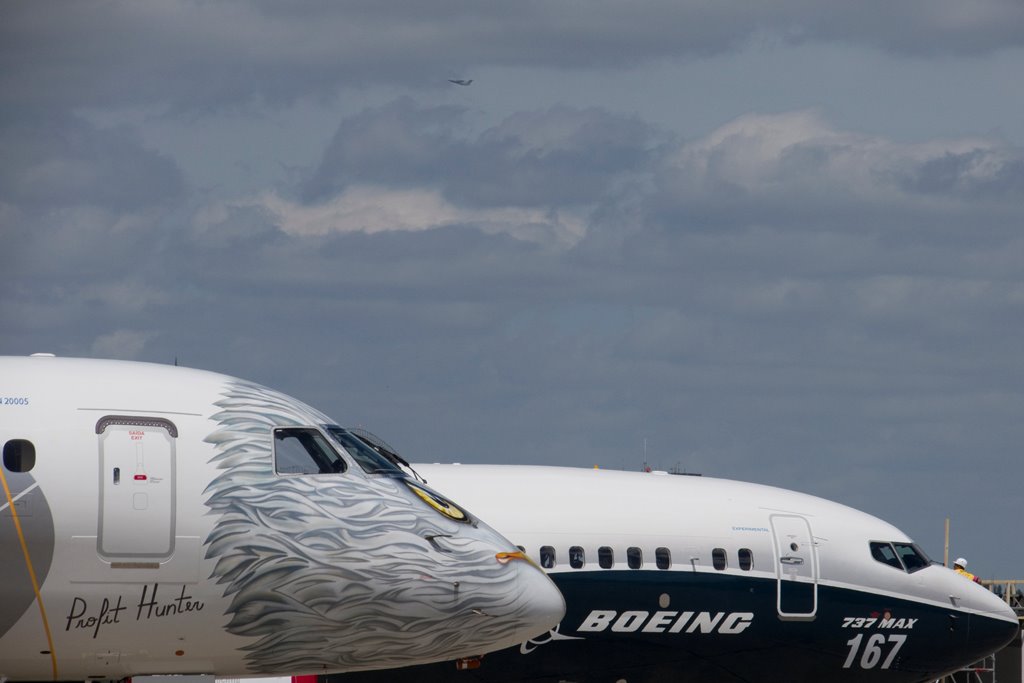 A Boeing 737 MAX and an Embraer E190-E2 are seen on the static display, before the opening of the 52nd Paris Air Show at Le Bourget airport near Paris, France, June 16, 2017. REUTERS/Pascal Rossignol
