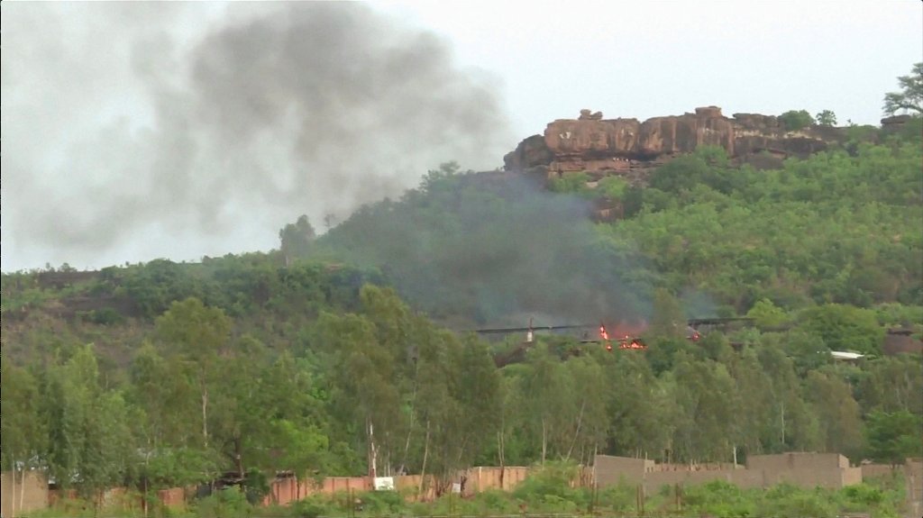 Flames rise following an attack where gunmen stormed Le Campement Kangaba resort in Dougourakoro, to the east of the capital Bamako, Mali in this still frame taken from video June 18, 2017. REUTERS/ REUTERS TV TPX IMAGES OF THE DAY.