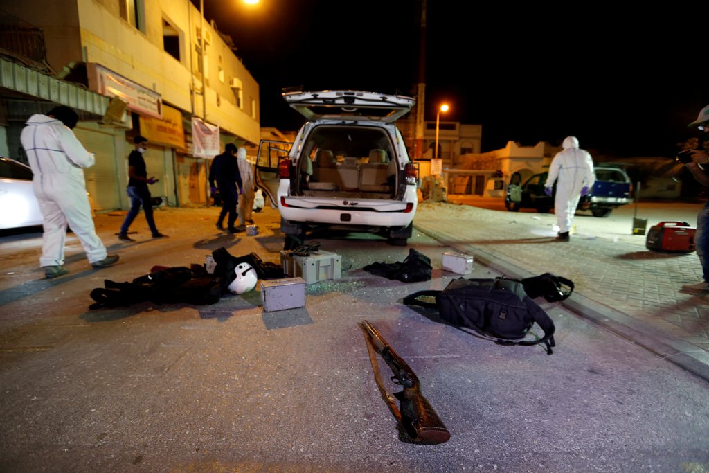 Crime scene personnel are seen gathering evidence where a blast took place in the village of Diraz, Bahrain, June 19, 2017. REUTERS/Hamad I Mohammed
