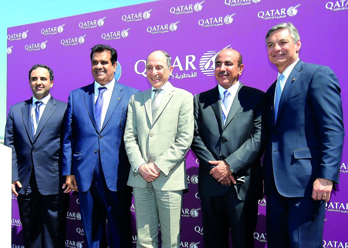 Minister of Transport and Communications H E Jassim bin Saif Al Sulaiti (second right) and Qatar Airways Group Chief Executive Akbar Al Baker (centre) with other officials on the first day of Paris Air Show yesterday.