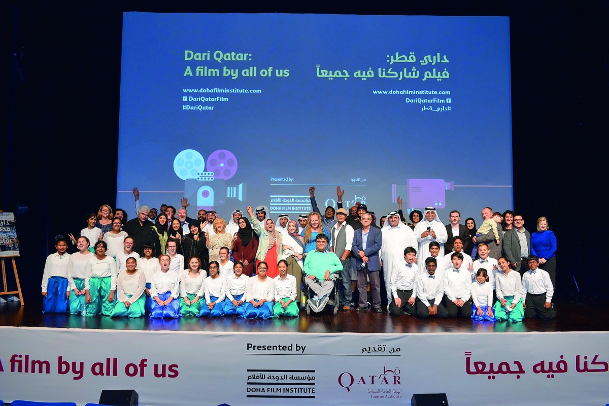 Fatma Al Remaihi, Chief Executive Officer of the Doha Film Institute, with contributors at the world premiere of DariQatar