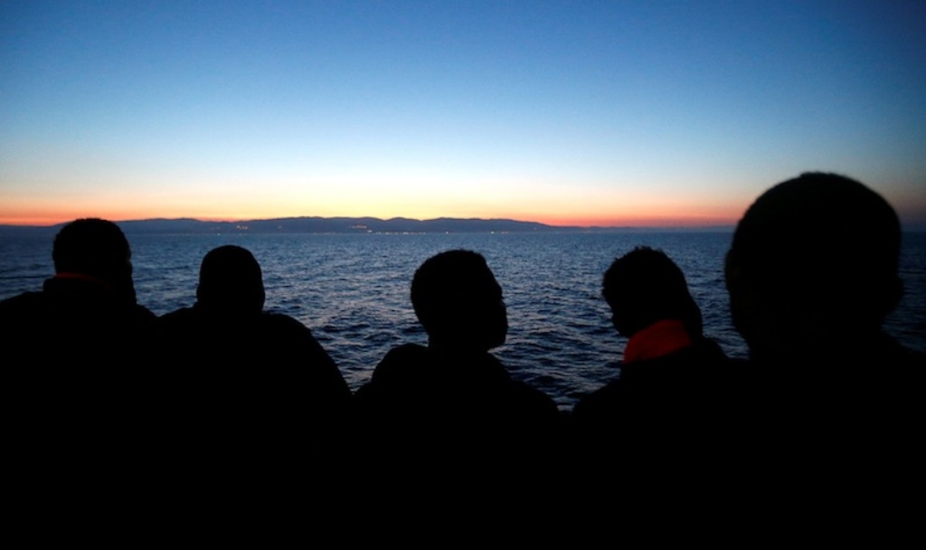 Migrants look at south Italy's coast as they approach on the Vos Hestia ship after being rescued by 'Save the Children' crew on the Mediterranean sea off the Libya coast, June 20, 2017. — Reuters pic.