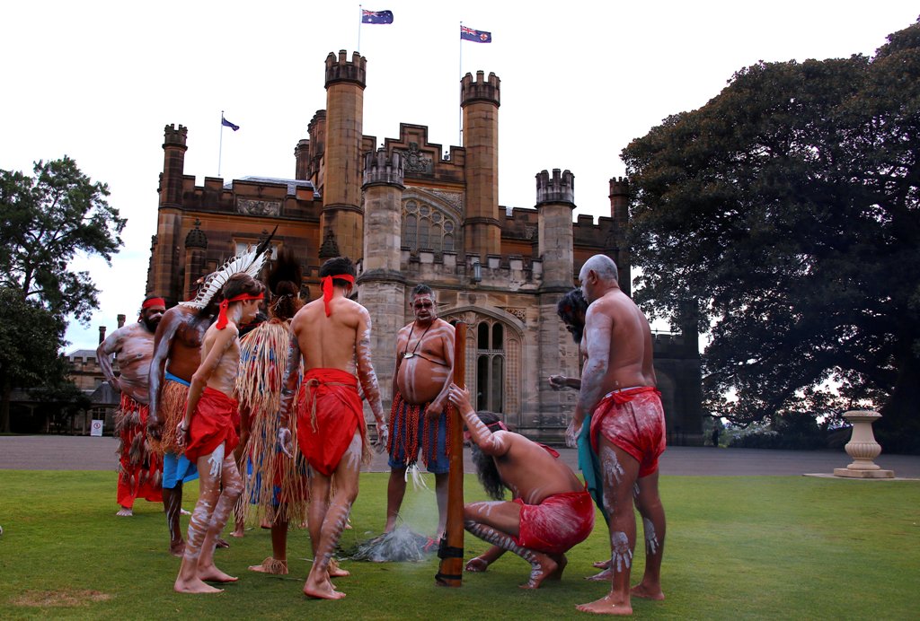Australian Aborigines and Torres Strait Islanders wearing traditional dress stand in front of Government House after performing in a welcoming ceremony in Sydney, Australia, June 28, 2017. REUTERS/David Gray
